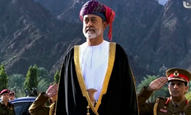 FILE - Oman's Sultan Haitham bin Tariq Al Said takes part in canon firing salute ceremony outside the Royal Family Council in Muscat, Oman, Jan. 11 2020. AP