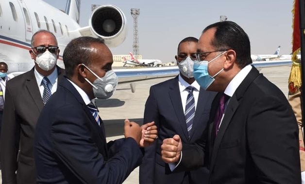 Egyptian Prime Minister Moustafa Madbouli receives his Somali counterpart Mohamed Hussein Roble at the Cairo International Airport- press photo
