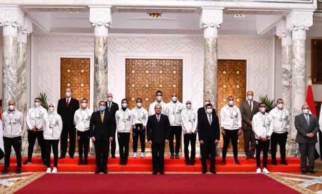 President Abdel Fatah al-Sisi posing with Egyptian Tokyo Olympics 2020 at Al Itihadiyah Palace on August 17, 2021. Press Photo