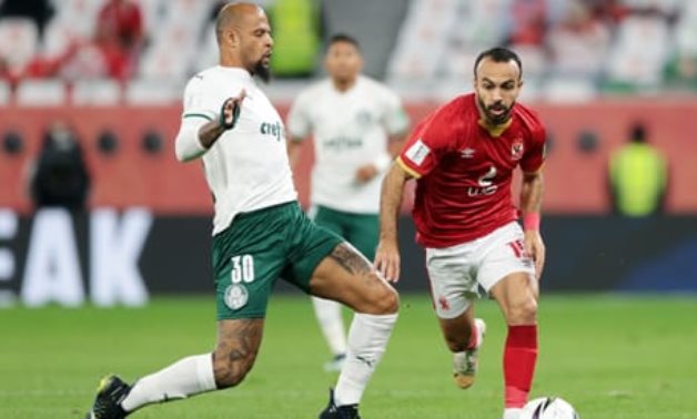 Al Ahly's Mohamed Afsha in action with Palmeiras' Felipe Melo REUTERS