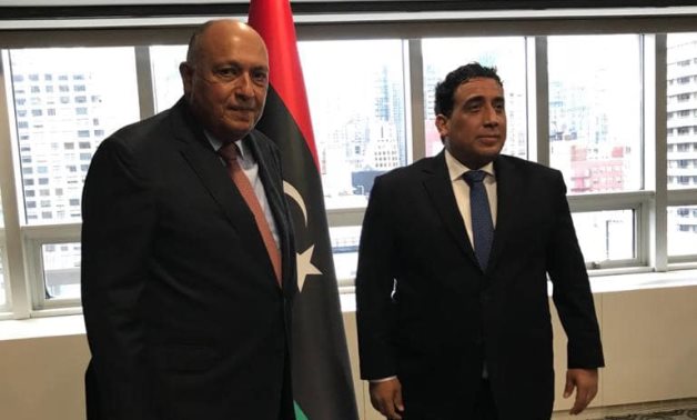Egypt’s Foreign Minister Sameh Shoukry (L) meets with President of the Libyan Presidential Council Mohamed Al-Menfi – Egyptian Foreign Ministry