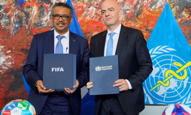 File - WHO Director-General Dr. Tedros Adhanom Ghebreyesus and FIFA President Gianni Infantino