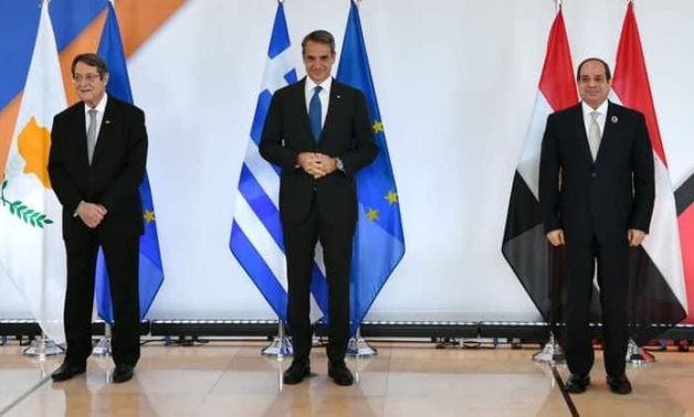 President Abdel Fatah al-Sisi, Greek Prime Minister Kyriakos Mitsotakis, and Cypriot President Nicos Anastasiades posing in 9th Tripartite Summit in Athens, Greece on October 19, 2021. Press Photo