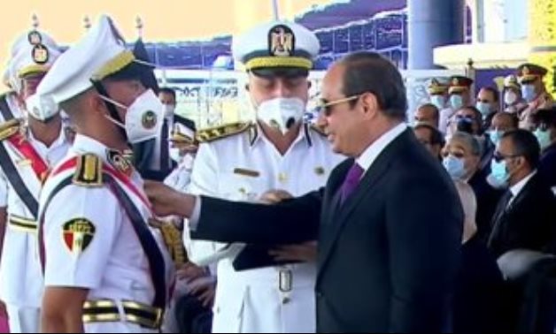 President Abdel Fatah al-Sisi honoring a student who ranks on top of his 2021 class graduating from Police Academy. TV screenshot
