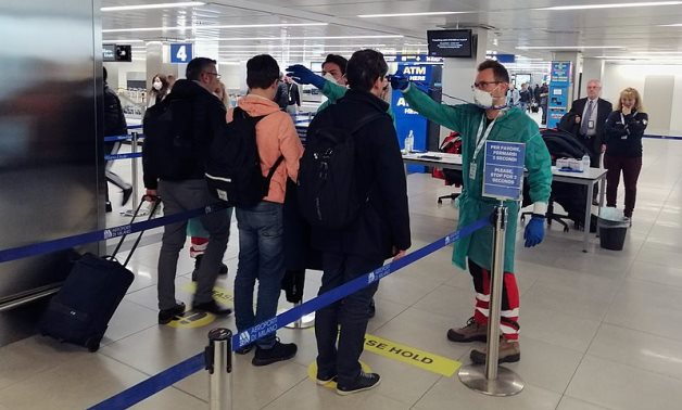 Milan Airport Authorities testing people's temperature on 6 Feb 2020