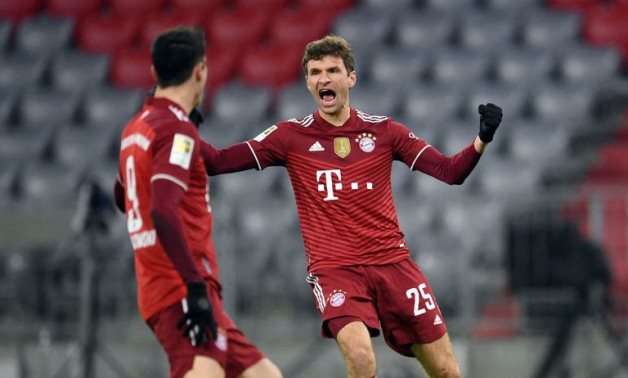 Thomas Muller celebrates scoring their first goal with Robert Lewandowski REUTERS/Andreas Gebert