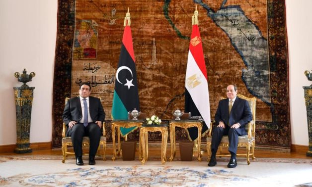 President Abdel Fatah al-Sisi and Head of the Libyan Presidential Council Mohamed al-Menfy in Cairo, Egypt on December 21, 2021. Press Photo