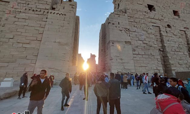 File: Tourists are watching Solar Alignment on Karnak Temple.