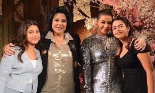 File: Essad Younis, Sherine Abdel Wahab and her two daughters.