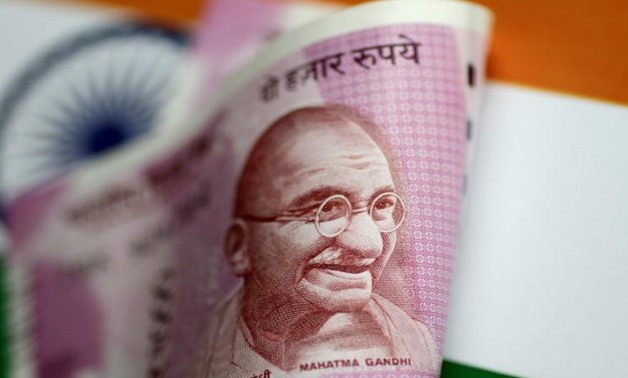 An India Rupee note is seen in this illustration photo June 1, 2017. REUTERS/Thomas White/Illustration/File Photo