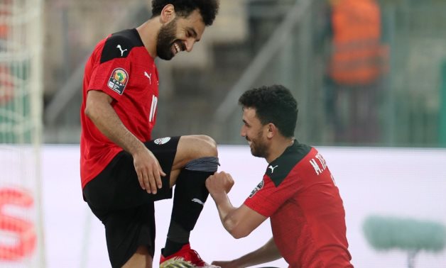 Salah and Trezeguet celebrate Egypt's second goal against Morocco