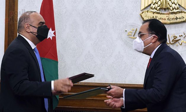 Prime Minister Mostafa Madbouli (l) and his Jordanian counterpart Beshr El Khasawna after signing cooperation documents in Cairo, Egypt on February 21, 2022. Press Photo