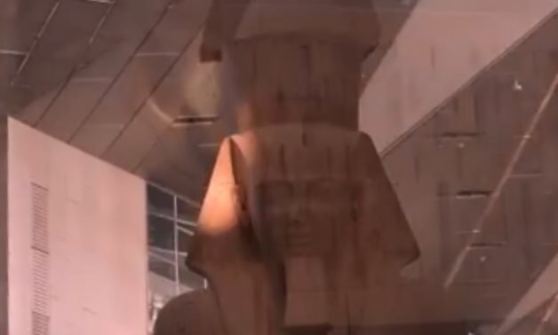 File: The sun shines on face of colossal statue of King Ramses II at Grand Egyptian Museum every year on February 21 