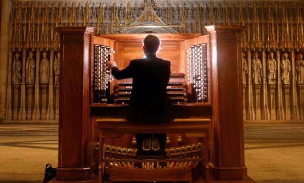 Musician playing the organ - social media