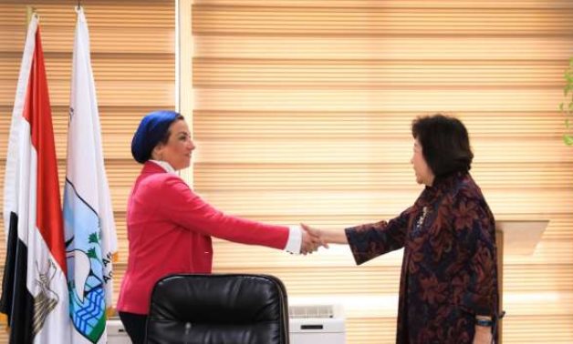 Minister of Environment Yasmin Fouad shaking hands with World Bank Managing Director of Development Policy and Partnership Mari Pangestu in Cairo, Egypt on April 5, 2022. Press Photo