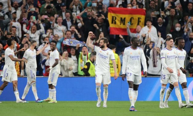 Real Madrid's Karim Benzema celebrates scoring their third goal with teammates REUTERS/Isabel Infantes
