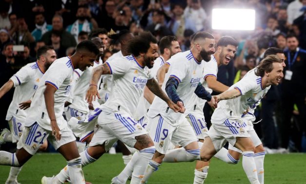 Real Madrid's Luka Modric, Karim Benzema and teammates celebrate after the match REUTERS/Isabel Infantes