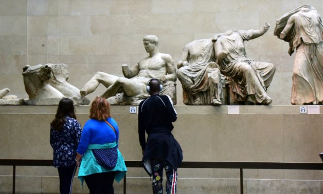 Visitors stand in front of Parthenon sculptures at London's British Museum. WALTRAUD GRUBITZSCH/PICTURE-ALLIANCE/DPA/AP IMAGES