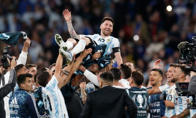 Argentina's Lionel Messi celebrates after winning the Finalissima with teammates REUTERS/Peter Cziborra