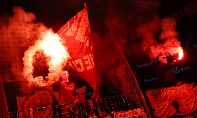 Bayern Munich fans let of flares in the stand during the match REUTERS/Kai Pfaffenbach DFL