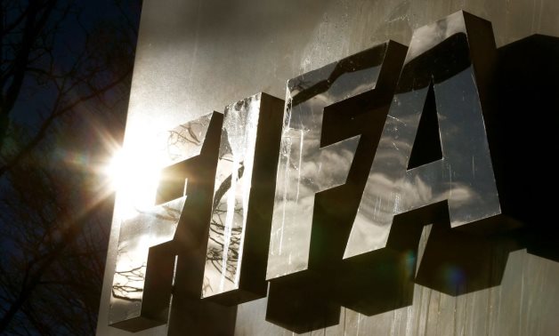 The sun is reflected in FIFA's logo in front of FIFA's headquarters in Zurich, Switzerland November 19, 2015. REUTERS/Arnd Wiegmann/File Photo