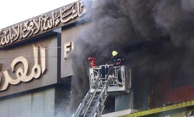 A huge fire that broke out in a basement of a four-storey building in Haret El Yahood, a bustling commercial alley in downtown Cairo’s Al Azhar district, May 2019. Hussein Talal