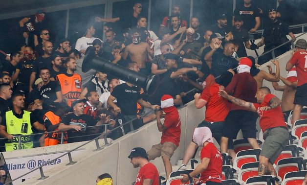 Fans clash before the match REUTERS/Eric Gaillard