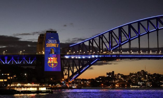 A projection of the FC Barcelona logo is seen on the Sydney Harbour Bridge as the squad visits Australia for a friendly soccer match against the A-League All-Stars, in Sydney, Australia, REUTERS/Loren Elliott
