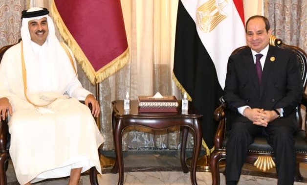 File- President Abdel Fattah El Sisi meets with Qatari Emir Tamim bin Hamad Al Thani in Baghdad on August 28, 2021, for the first time in more than four years since severing ties in 2017- press photo