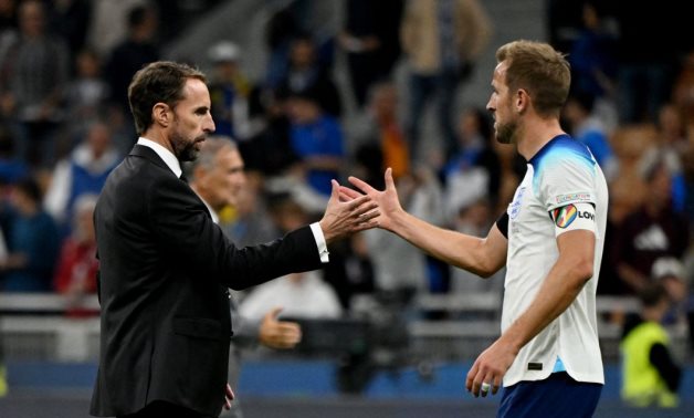 England manager Gareth Southgate shakes hands with Harry Kane after the match REUTERS/Alberto Lingria