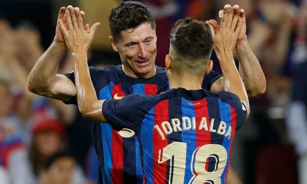 FC Barcelona's Robert Lewandowski celebrates scoring their second goal with Jordi Alba REUTERS/Albert Gea