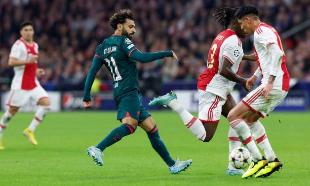 Liverpool's Mohamed Salah in action with Ajax Amsterdam's Calvin Bassey and Edson Alvarez REUTERS/Piroschka Van De Wouw