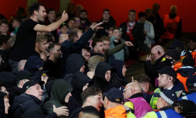 Arsenal fans clash with PSV Eindhoven fans in the stands as the police intervene after the match Action Images via Reuters/Matthew Childs