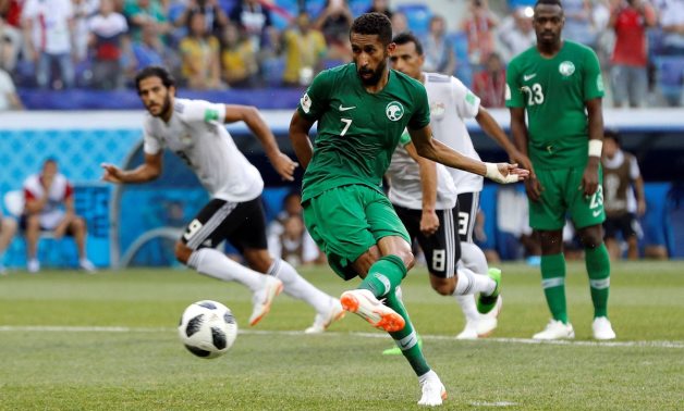 Saudi Arabia's Salman Al-Faraj scores their first goal from the penalty spot. REUTERS/Darren Staples