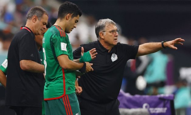 Mexico coach Gerardo Martino with Raul Jimenez before he comes on as a substitute REUTERS/Matthew Childs