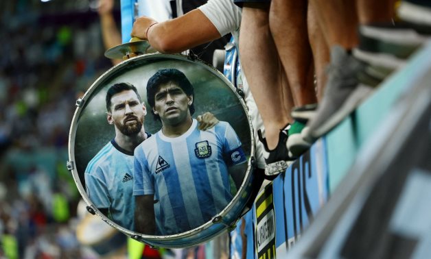 Argentina's Lionel Messi and Diego Maradona are pictured in a fans drum inside the stadium before the match REUTERS/Molly Darlington