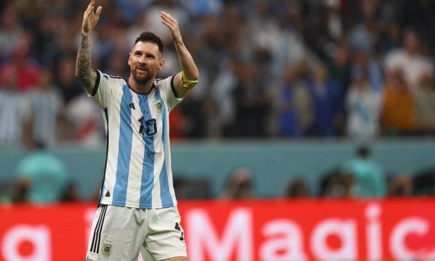 Argentina's Lionel Messi celebrates after Julian Alvarez scores their third goal REUTERS/Kai Pfaffenbach