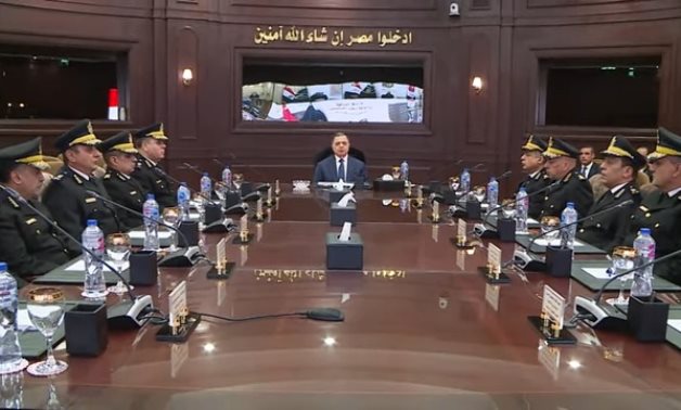 FILE - Egyptian Minister of Interior Mahmoud Tawfik holds a meeting with aides and security leaders