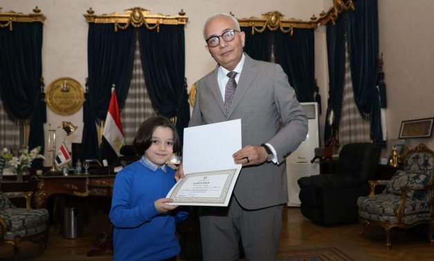 Minister of Education and Technical Education Reda Hegazy honoring Grade 2 Student Omar Zaki on January 1, 2022. Press Photo 