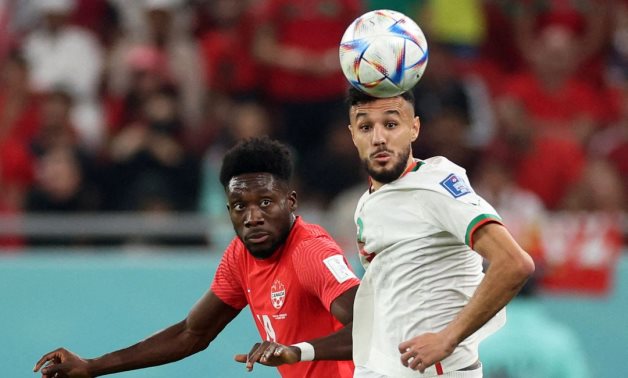 Morocco's Noussair Mazraoui in action with Canada's Alphonso Davies REUTERS/Carl Recine
