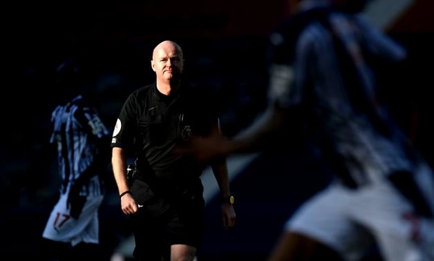 Referee Lee Mason Pool via REUTERS/Peter Powell.