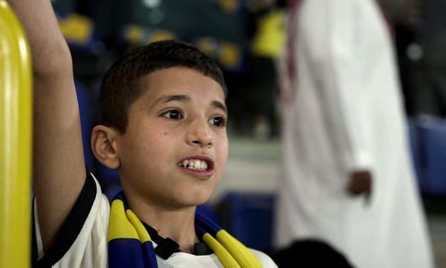 Syrian boy Nabil Saeed, who achieved his dream of meeting Al-Nasr's Cristiano Ronaldo, cheers for Al-Nasr during a match between Al-Nasr and Al-Batin, in Marsool Park Stadium. REUTERS/Mohammed Benmansour