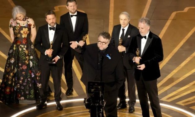 File:  Guillermo del Toro along with  Pinocchio cast. 