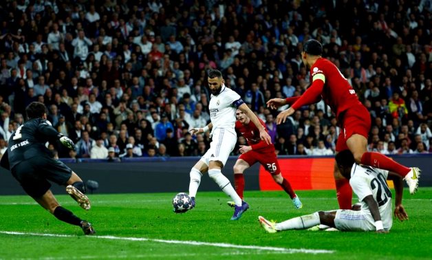 Real Madrid's Karim Benzema scores their first goal past Liverpool's Alisson REUTERS/Susana Vera 