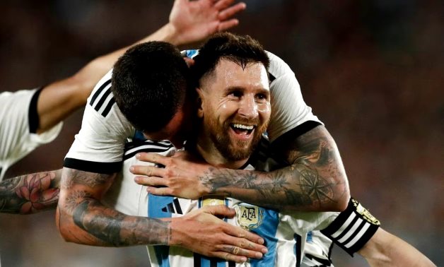 Argentina's Lionel Messi celebrates scoring their second goal with teammates REUTERS/Agustin Marcarian