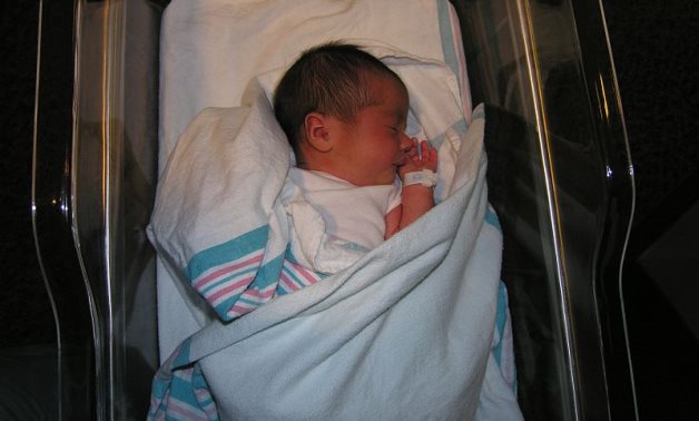 A newborn baby in a hospital nursery - Wikimedia/Bonnie U. Gruenberg