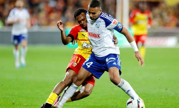  RC Strasbourg's Alexander Djiku in action with RC Lens' Lois Openda REUTERS/Pascal Rossignol