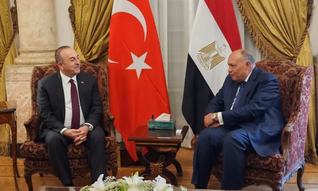 FILE- FM Sameh Shoukry receives Turkish FM Mevlüt Çavuşoğlu at the Egyptian Foreign Ministry premise at Tahrir Palace in Cairo on March 18, 2023- press photo