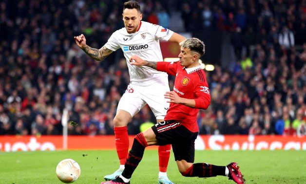 Manchester United's Lisandro Martinez in action with Sevilla's Lucas Ocampos REUTERS/Carl Recine/File Photo