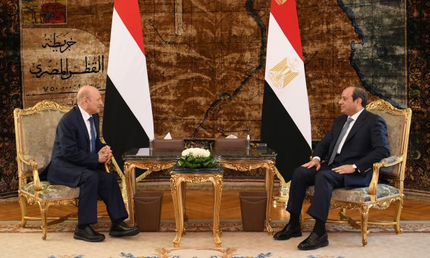 Egypt's President Abdel Fattah El-Sisi (R) receives President of the Yemeni Presidential Leadership Council Rashad Al-Alimi (L) in Egypt - Presidency